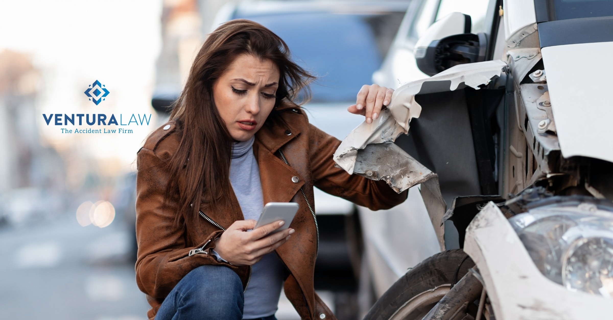 A woman making a phone call after a car accident, documenting the scene for safety and legal purposes.