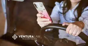 Driver distracted by phone while behind the wheel in Connecticut traffic