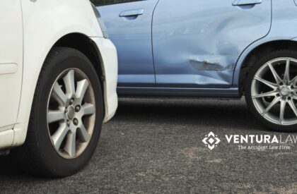 Minor car accident in Connecticut with two vehicles showing light damage, representing the hidden injuries and legal issues that can follow.