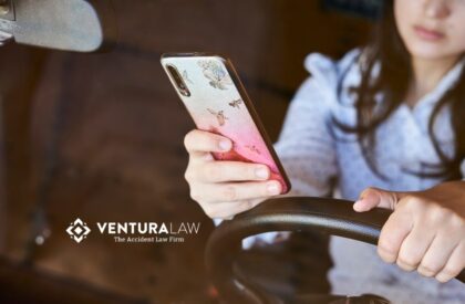 Distracted teen driver texting while driving in Connecticut, highlighting Ventura Law’s commitment to preventing car accidents and promoting teen driver safety.